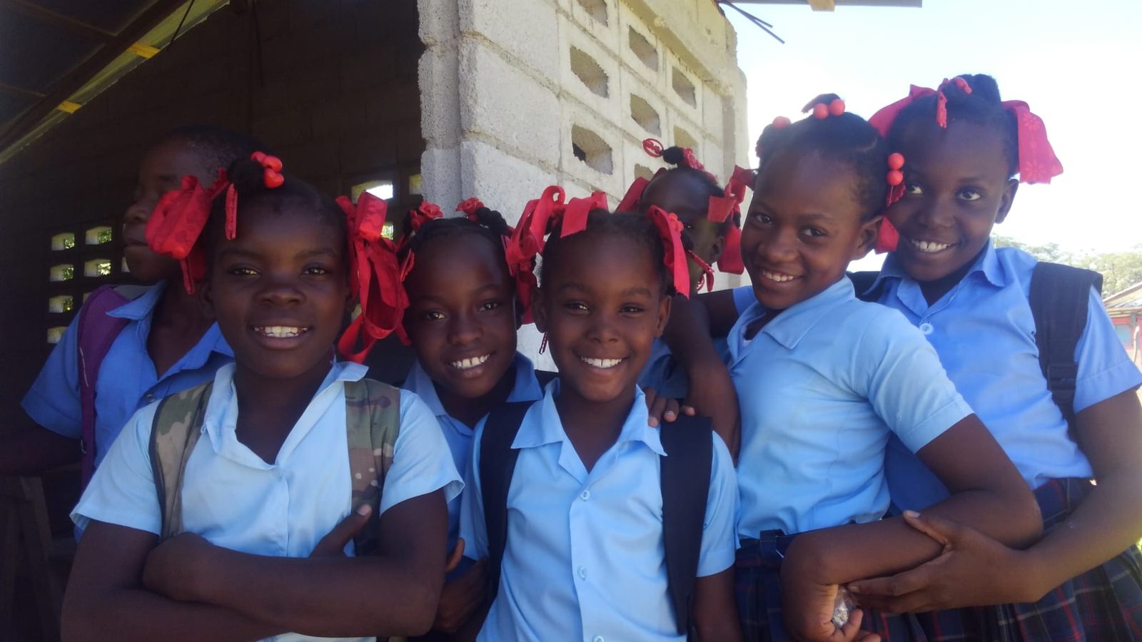 Students smiling together in a classroom